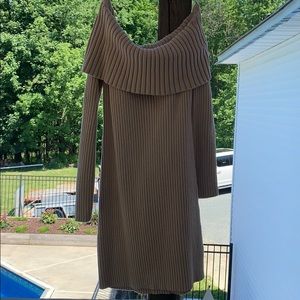 A cream colored sweater dress.